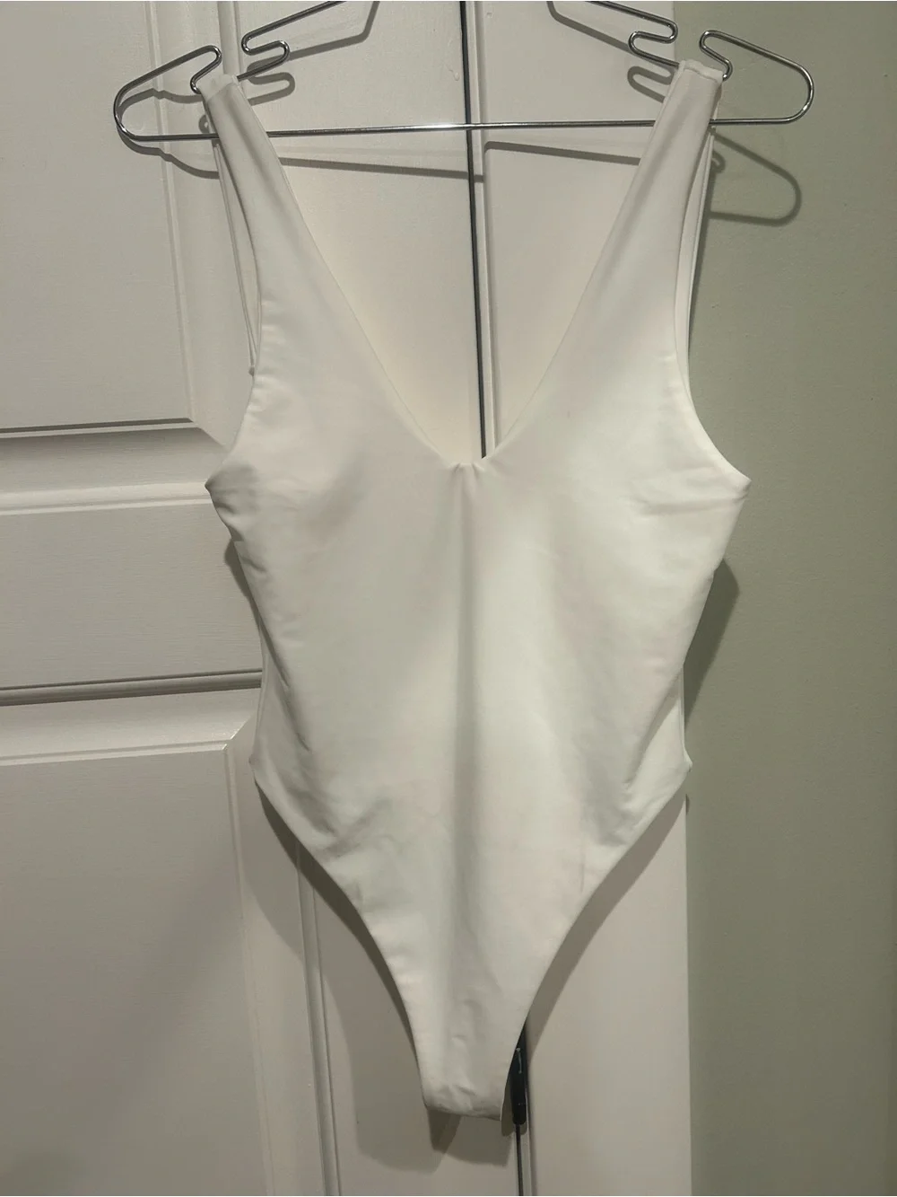 Sleek White V-Neck One-Piece Swimsuit